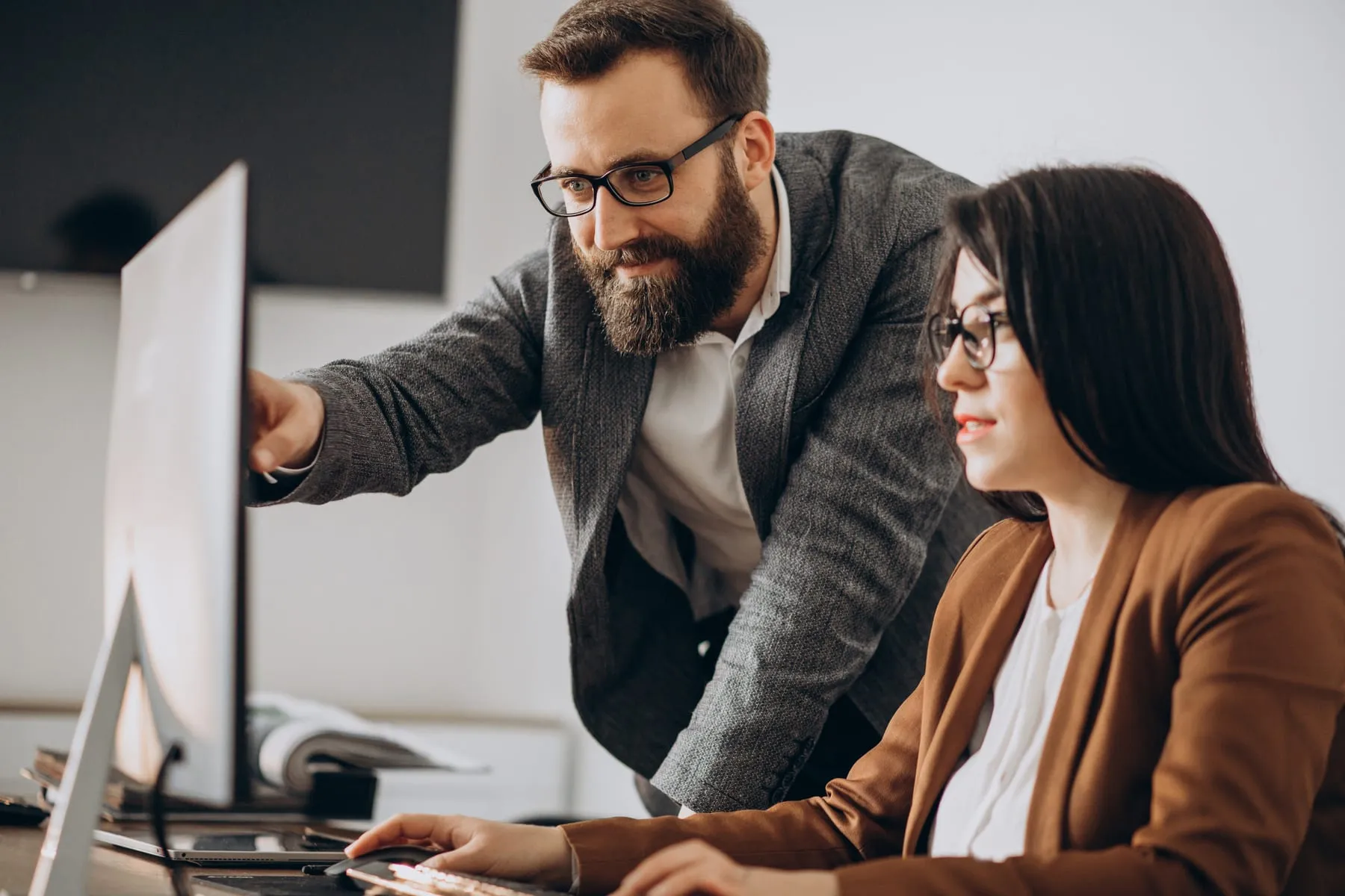 Two business partners working together office computer