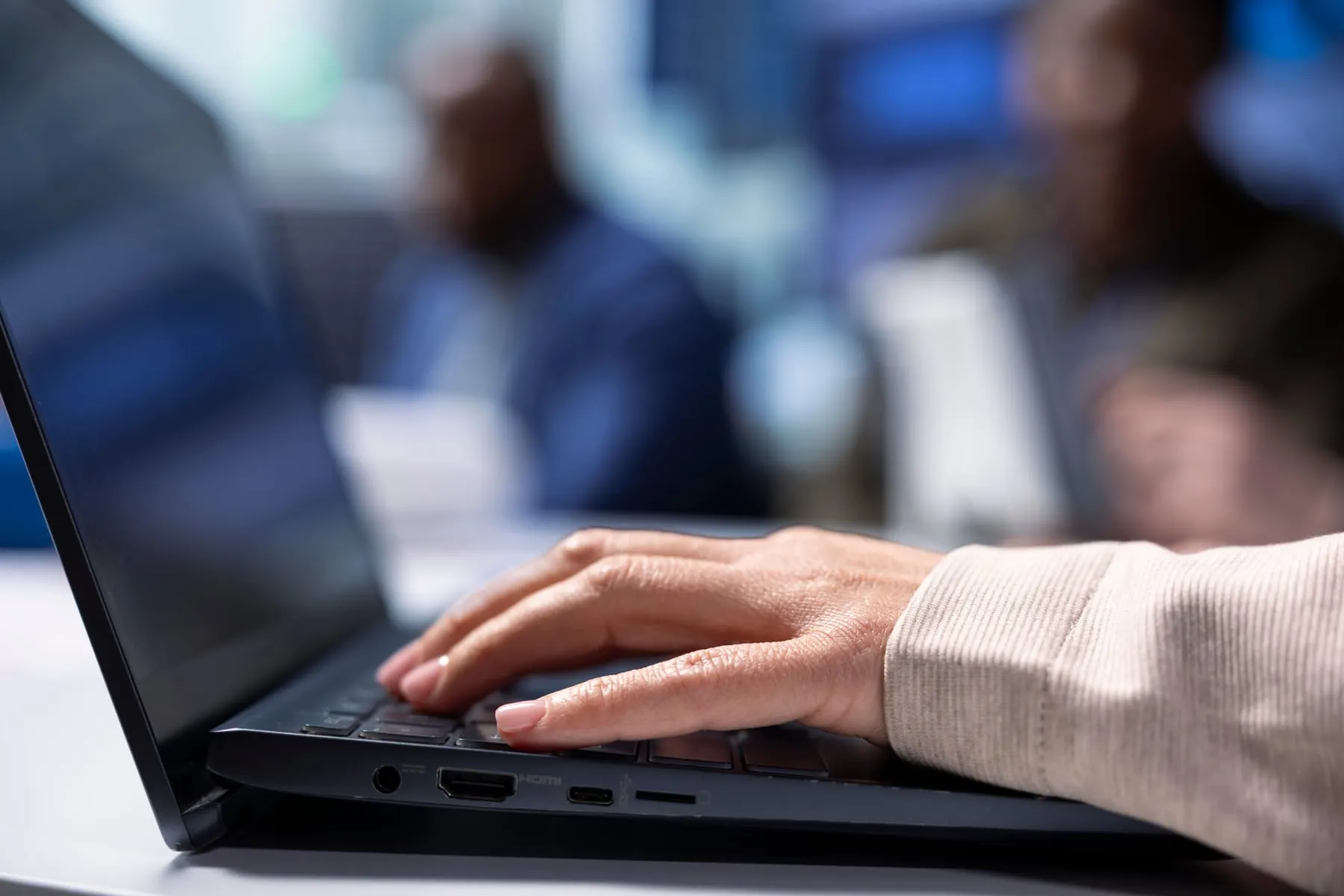 Investors using laptop screening before investing factory