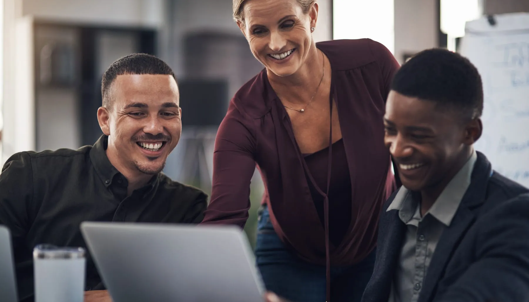 Meeting happy business people laptop presentation planning teamwork collaboration corporate office discussion men women with documents computer online