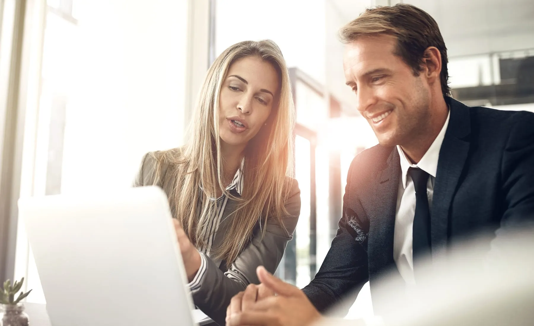 Collaboration laptop planning with business people office feedback discussion meeting computer smile teamwork with corporate man woman professional