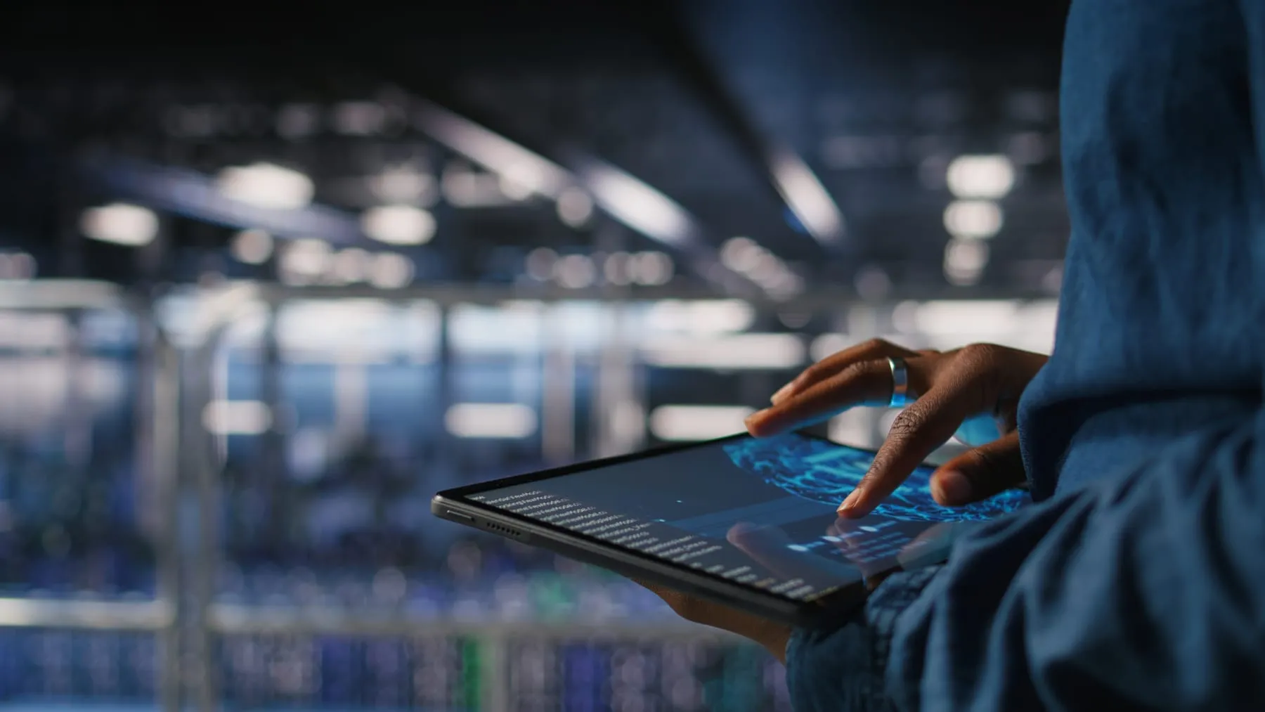Close up data center engineer using tablet doing maintenance ai rigs